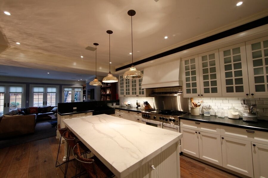 An illuminated kitchen featuring various Control4 lighting fixtures.